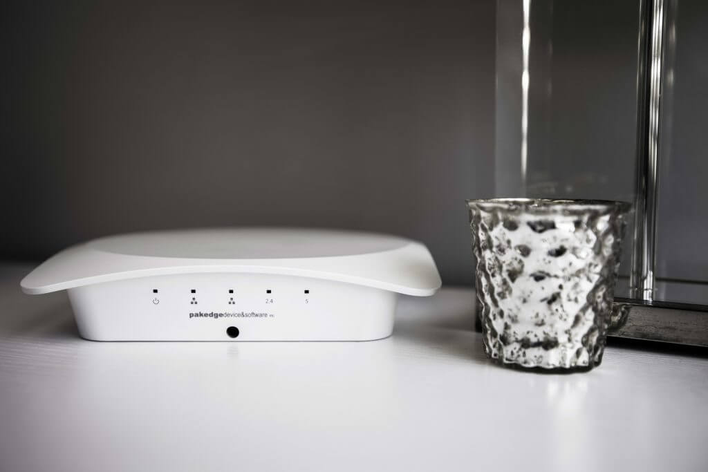 White wireless networking device on a counter
