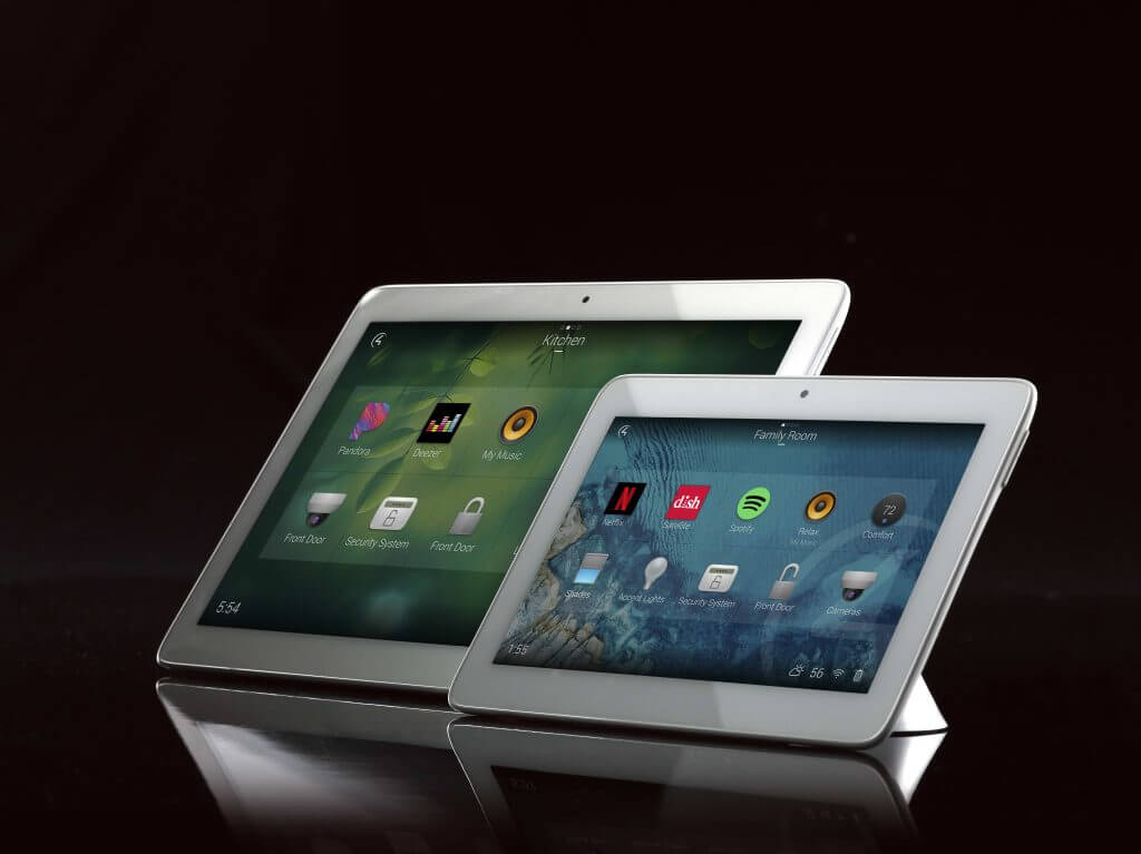 Two white tabletop room control touchscreens