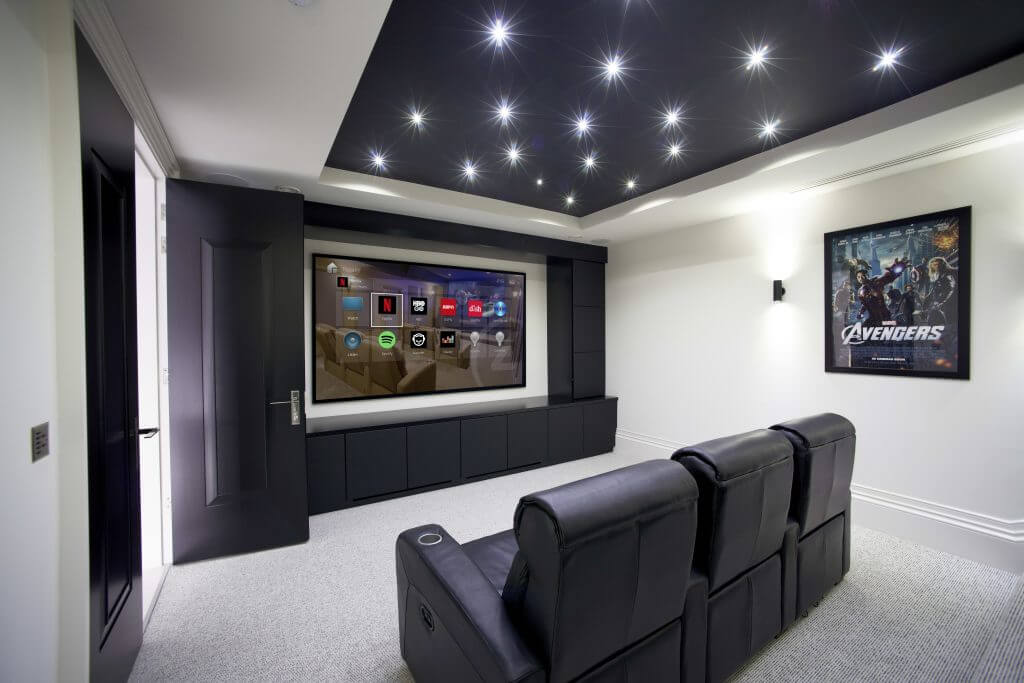 Home theater with reclining seats and a star ceiling